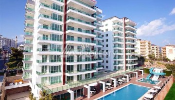 Светлая квартира 2+1 с гарантированным ВНЖ в районе Тосмур, 300 м до моря - Ракурс 1