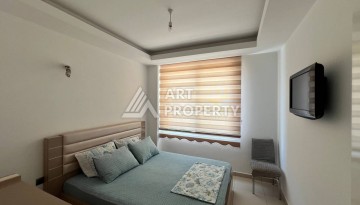 Светлая квартира 2+1 с гарантированным ВНЖ в районе Тосмур, 300 м до моря - Ракурс 18