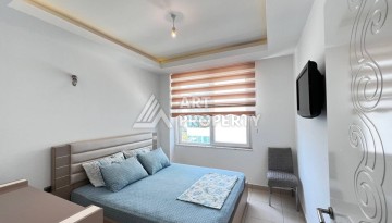 Светлая квартира 2+1 с гарантированным ВНЖ в районе Тосмур, 300 м до моря - Ракурс 58