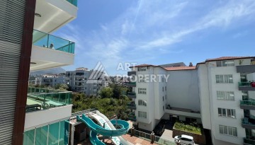 Светлая квартира 2+1 с гарантированным ВНЖ в районе Тосмур, 300 м до моря - Ракурс 59