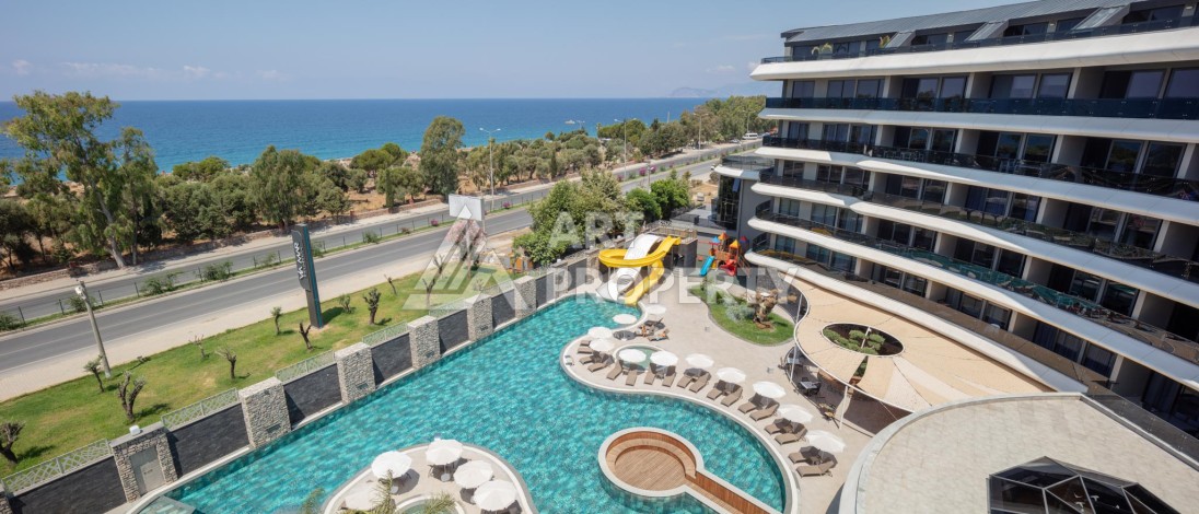 Премиальная квартира 1+1 с панорамным видом на море на первой линии в Каргыджаке - Ракурс 0