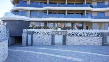 Премиальная квартира 1+1 с панорамным видом на море на первой линии в Каргыджаке - Ракурс 41