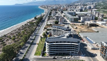 Премиальная квартира 1+1 с панорамным видом на море на первой линии в Каргыджаке - Ракурс 44