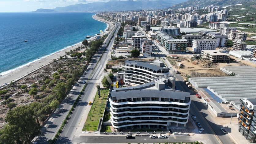 Премиальная квартира 1+1 с панорамным видом на море на первой линии в Каргыджаке - Ракурс 43