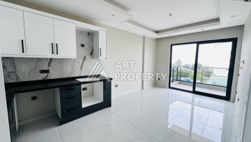 Новая квартира 1+1 с видом на море в районе Каргыджак, первая линия - Ракурс 1