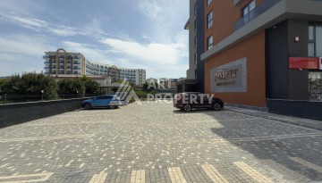 Новая квартира 1+1 в доме 2024 года в районе Каргыджак, 70 метров до моря - Ракурс 12