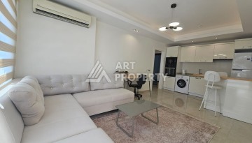 Квартира 1+1 в комплексе с отельной инфраструктурой, район Махмутлар, 500 м до моря - Ракурс 1