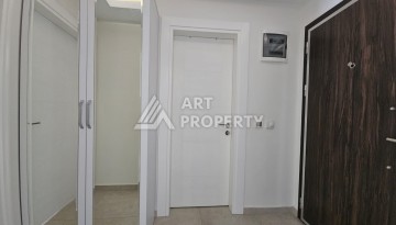 Квартира 1+1 в комплексе с отельной инфраструктурой, район Махмутлар, 500 м до моря - Ракурс 2