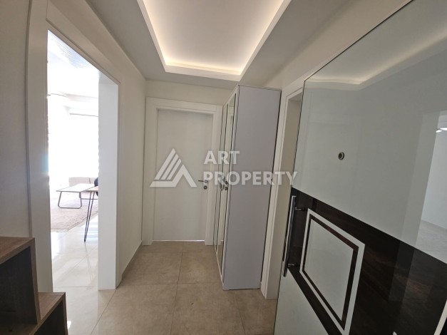 Квартира 1+1 в комплексе с отельной инфраструктурой, район Махмутлар, 500 м до моря - Ракурс 2