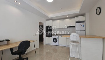 Квартира 1+1 в комплексе с отельной инфраструктурой, район Махмутлар, 500 м до моря - Ракурс 4