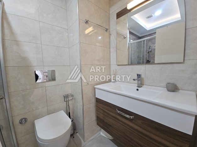 Квартира 1+1 в комплексе с отельной инфраструктурой, район Махмутлар, 500 м до моря - Ракурс 7