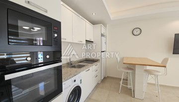 Квартира 1+1 в комплексе с отельной инфраструктурой, район Махмутлар, 500 м до моря - Ракурс 12