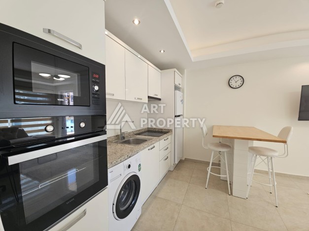 Квартира 1+1 в комплексе с отельной инфраструктурой, район Махмутлар, 500 м до моря - Ракурс 11