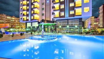 Срочная продажа большой квартиры 1+1 в элитном ЖК, 100 метров от моря в Махмутларе - Ракурс 4