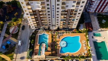 Срочная продажа большой квартиры 1+1 в элитном ЖК, 100 метров от моря в Махмутларе - Ракурс 6