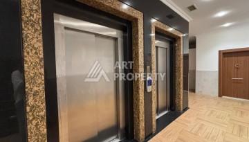 Срочная продажа большой квартиры 1+1 в элитном ЖК, 100 метров от моря в Махмутларе - Ракурс 12