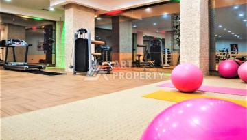 Срочная продажа большой квартиры 1+1 в элитном ЖК, 100 метров от моря в Махмутларе - Ракурс 14