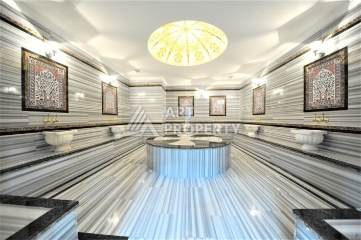 Срочная продажа большой квартиры 1+1 в элитном ЖК, 100 метров от моря в Махмутларе - Ракурс 20