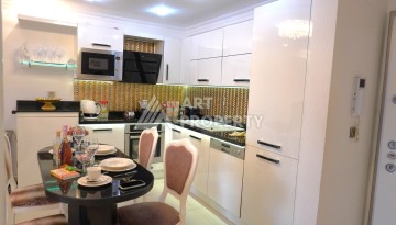 Срочная продажа большой квартиры 1+1 в элитном ЖК, 100 метров от моря в Махмутларе - Ракурс 43