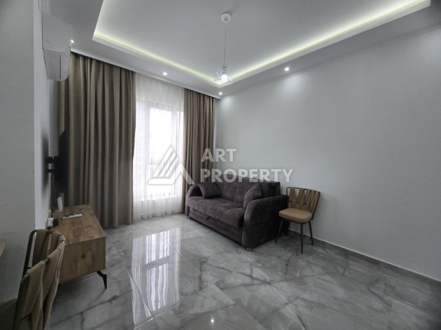 Меблированная квартира 1+1 в центре Махмутлара, 58 кв.м. - Ракурс 11