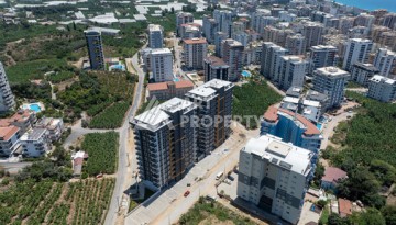 Квартиры 1+1 в люкс-резиденции, 650 м до моря в Махмутларе - Ракурс 16