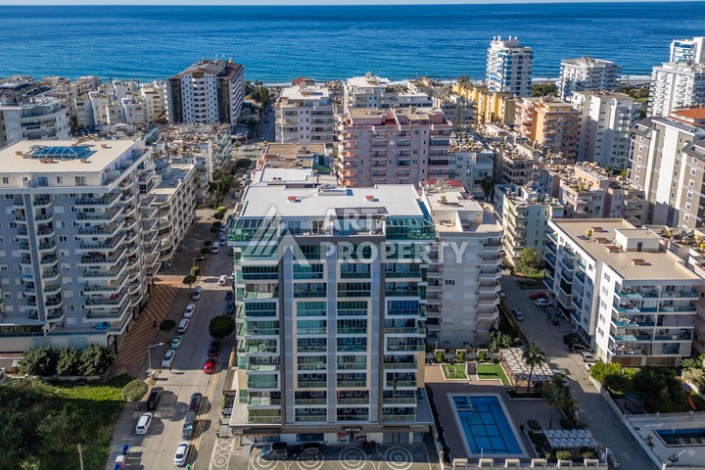 Стильная квартира 1+1 в Махмутларе в комплексе индивидуальным архитектурным дизайном в 250 метрах от моря - Ракурс 0