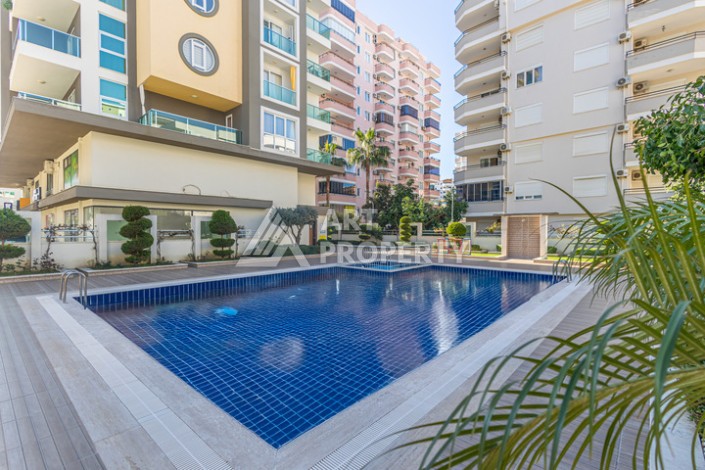 Стильная квартира 1+1 в Махмутларе в комплексе индивидуальным архитектурным дизайном в 250 метрах от моря - Ракурс 1