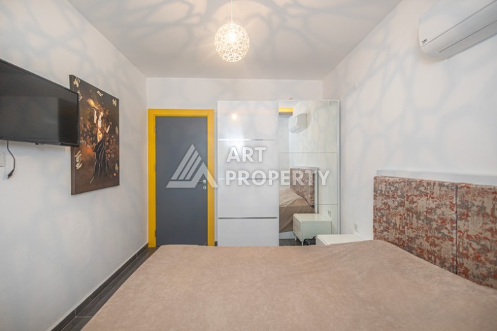 Стильная квартира 1+1 в Махмутларе в комплексе индивидуальным архитектурным дизайном в 250 метрах от моря - Ракурс 3