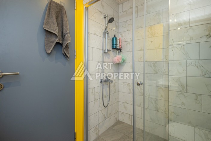 Стильная квартира 1+1 в Махмутларе в комплексе индивидуальным архитектурным дизайном в 250 метрах от моря - Ракурс 4