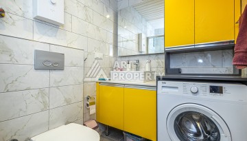 Стильная квартира 1+1 в Махмутларе в комплексе индивидуальным архитектурным дизайном в 250 метрах от моря - Ракурс 6