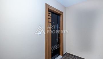 Стильная квартира 1+1 в Махмутларе в комплексе индивидуальным архитектурным дизайном в 250 метрах от моря - Ракурс 7