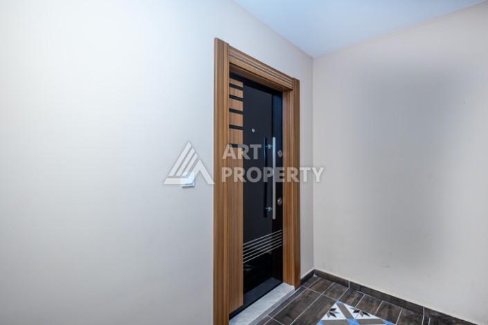 Стильная квартира 1+1 в Махмутларе в комплексе индивидуальным архитектурным дизайном в 250 метрах от моря - Ракурс 6