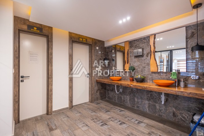 Стильная квартира 1+1 в Махмутларе в комплексе индивидуальным архитектурным дизайном в 250 метрах от моря - Ракурс 18