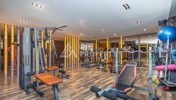 Стильная квартира 1+1 в Махмутларе в комплексе индивидуальным архитектурным дизайном в 250 метрах от моря - Ракурс 24