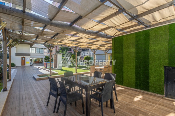 Стильная квартира 1+1 в Махмутларе в комплексе индивидуальным архитектурным дизайном в 250 метрах от моря - Ракурс 25