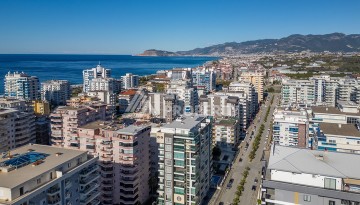 Стильная квартира 1+1 в Махмутларе в комплексе индивидуальным архитектурным дизайном в 250 метрах от моря - Ракурс 29