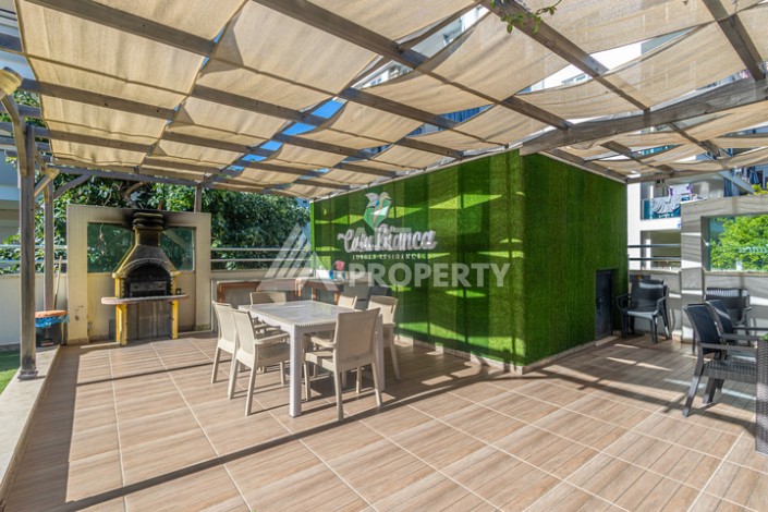 Стильная квартира 1+1 в Махмутларе в комплексе индивидуальным архитектурным дизайном в 250 метрах от моря - Ракурс 32