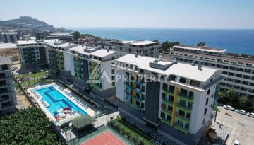 Меблированная квартира 1+1 в элитной резиденции в Каргыджаке, всего 100 м от моря - Ракурс 1