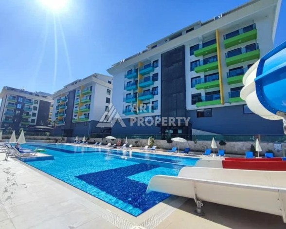 Меблированная квартира 1+1 в элитной резиденции в Каргыджаке, всего 100 м от моря - Ракурс 1