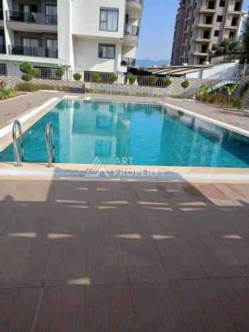 Квартира 1+1 в центре Махмутлара, 50 кв.м. - Ракурс 1