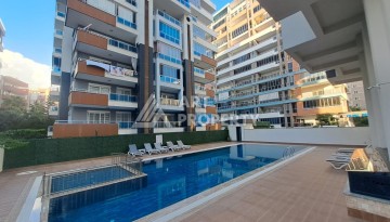 Квартира 1+1 на улице Барбаросса с боковым видом на море в Махмутларе, 55 кв.м. - Ракурс 1