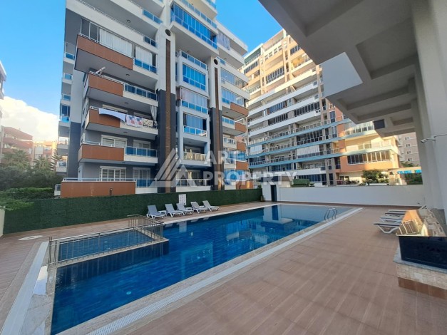 Квартира 1+1 на улице Барбаросса с боковым видом на море в Махмутларе, 55 кв.м. - Ракурс 0