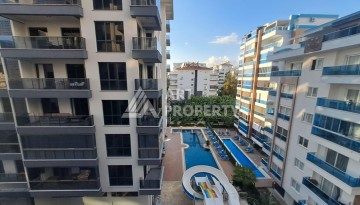 Квартира 1+1 на улице Барбаросса с боковым видом на море в Махмутларе, 55 кв.м. - Ракурс 2