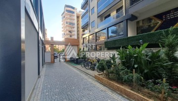 Квартира 1+1 на улице Барбаросса с боковым видом на море в Махмутларе, 55 кв.м. - Ракурс 4