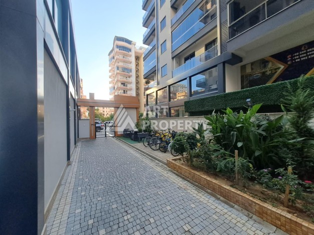 Квартира 1+1 на улице Барбаросса с боковым видом на море в Махмутларе, 55 кв.м. - Ракурс 3