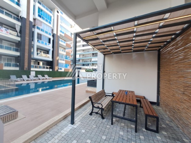 Квартира 1+1 на улице Барбаросса с боковым видом на море в Махмутларе, 55 кв.м. - Ракурс 5