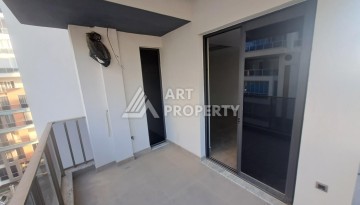 Квартира 1+1 на улице Барбаросса с боковым видом на море в Махмутларе, 55 кв.м. - Ракурс 12