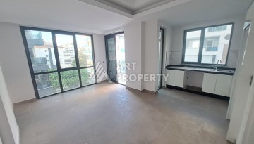 Квартира 1+1 на улице Барбаросса с боковым видом на море в Махмутларе, 55 кв.м. - Ракурс 13