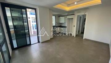 Квартира 1+1 на улице Барбаросса с боковым видом на море в Махмутларе, 55 кв.м. - Ракурс 14