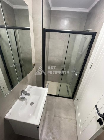 Квартира 1+1 на улице Барбаросса с боковым видом на море в Махмутларе, 55 кв.м. - Ракурс 15